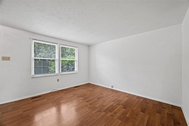 305 Laporte Ct, Cranberry Twp, PA 16066 - spare room with wood finished floors and a textured ceiling