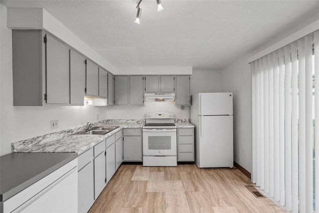 305 Laporte Ct, Cranberry Twp, PA 16066 - kitchen with white appliances, gray cabinets, under cabinet range hood, light wood-type flooring, and light countertops
