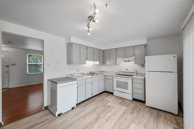 305 Laporte Ct, Cranberry Twp, PA 16066 - kitchen with white appliances, under cabinet range hood, gray cabinetry, light wood-type flooring, and a textured ceiling