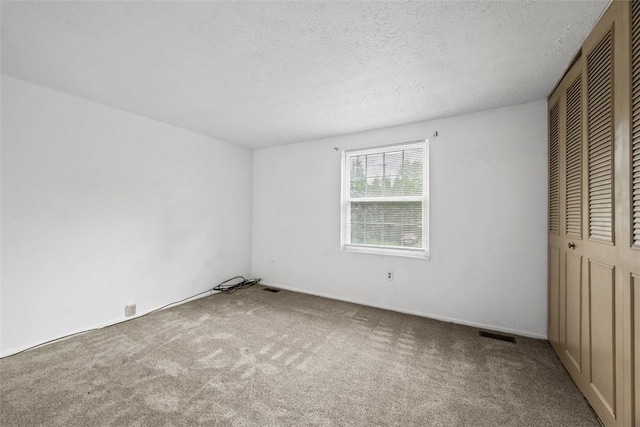 305 Laporte Ct, Cranberry Twp, PA 16066 - unfurnished bedroom with carpet, a closet, and a textured ceiling