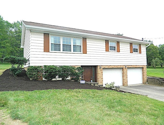 115 Lowery Dr, Middlesex Twp, PA 16059 - view of front of house featuring a garage, asphalt driveway, a front lawn, and brick siding