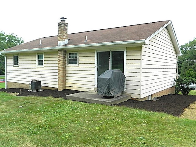 115 Lowery Dr, Middlesex Twp, PA 16059 - rear view of house with a chimney and a yard