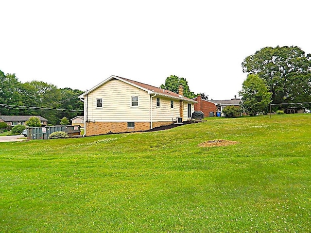 115 Lowery Dr, Middlesex Twp, PA 16059 - view of side of home featuring a lawn and a chimney