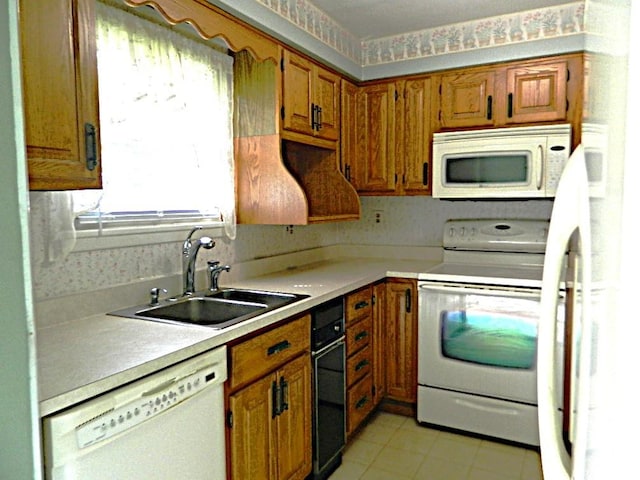 115 Lowery Dr, Middlesex Twp, PA 16059 - kitchen with white appliances, brown cabinetry, light countertops, and light tile patterned flooring