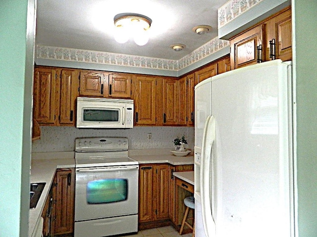 115 Lowery Dr, Middlesex Twp, PA 16059 - kitchen featuring white appliances, brown cabinets, and light countertops