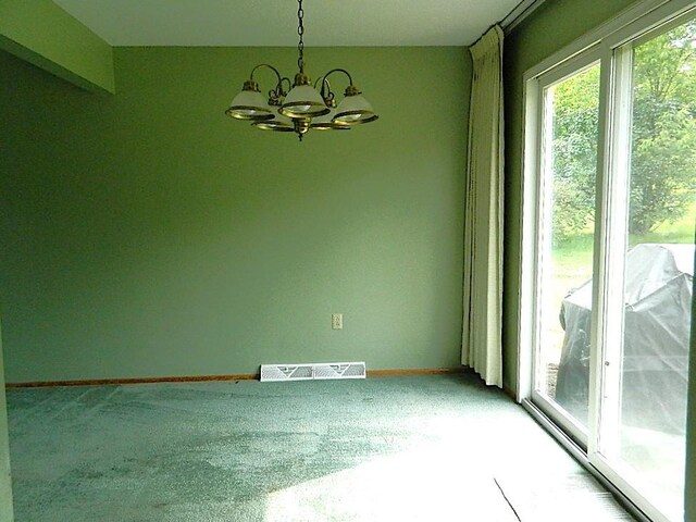 115 Lowery Dr, Middlesex Twp, PA 16059 - empty room featuring a chandelier and light carpet