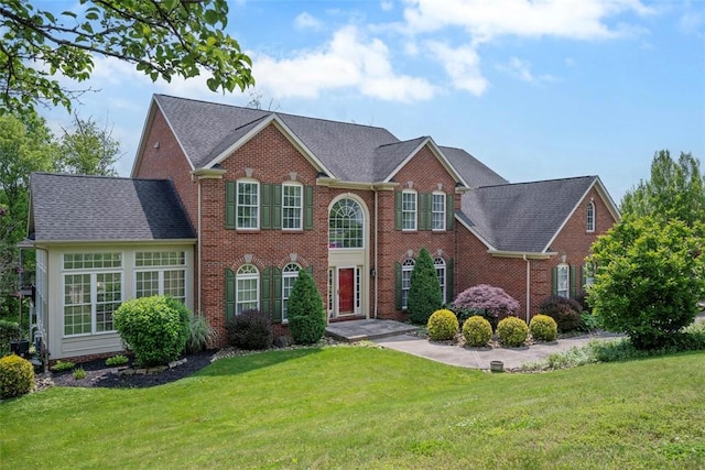 1011 Lakeside Dr, Mount Pleasant Twp Was, PA 15057 - view of front of home featuring a front yard and brick siding