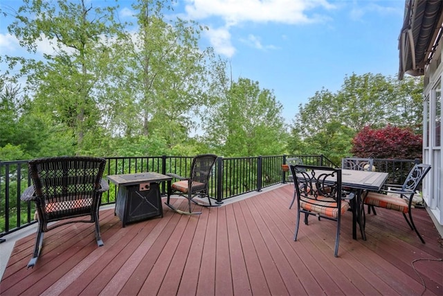 1011 Lakeside Dr, Mount Pleasant Twp Was, PA 15057 - deck with outdoor dining space and a fire pit