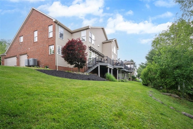 1011 Lakeside Dr, Mount Pleasant Twp Was, PA 15057 - view of home's exterior with a garage, a deck, a yard, stairs, and brick siding