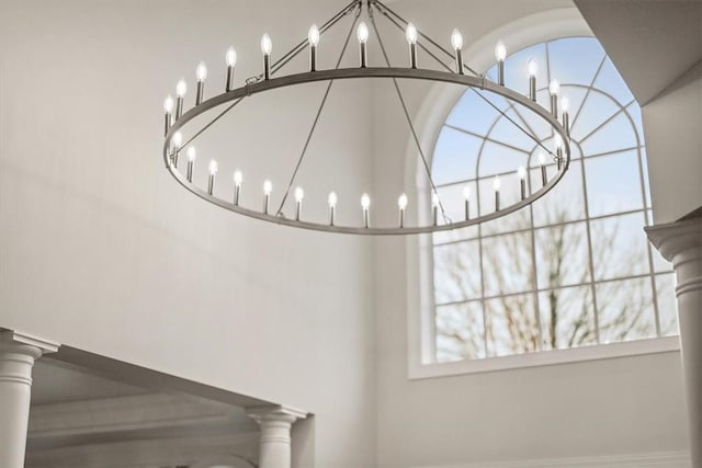 1011 Lakeside Dr, Mount Pleasant Twp Was, PA 15057 - detailed view of a chandelier and decorative columns