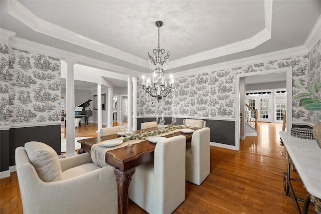 1011 Lakeside Dr, Mount Pleasant Twp Was, PA 15057 - dining room featuring wallpapered walls, a wainscoted wall, a chandelier, stairs, and wood finished floors