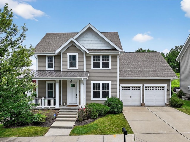 201 Venango Trl, Marshall, PA 16046 - view of front of house featuring covered porch, a garage, a standing seam roof, concrete driveway, and a metal roof