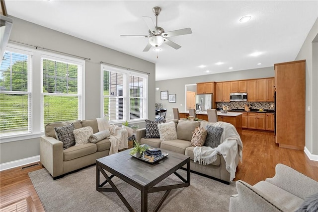 201 Venango Trl, Marshall, PA 16046 - living room featuring plenty of natural light, light wood-type flooring, a ceiling fan, and recessed lighting