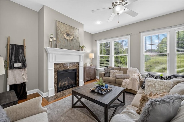 201 Venango Trl, Marshall, PA 16046 - living area with wood finished floors, ceiling fan, and a high end fireplace