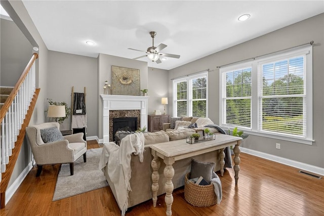 201 Venango Trl, Marshall, PA 16046 - living room featuring stairs, ceiling fan, a high end fireplace, wood finished floors, and recessed lighting