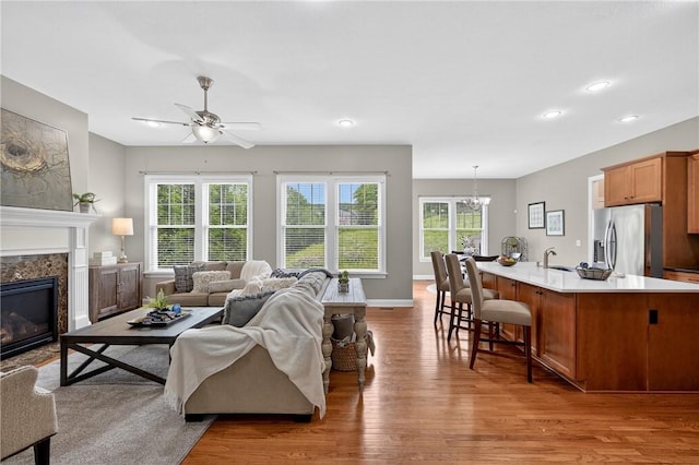 201 Venango Trl, Marshall, PA 16046 - living room featuring wood finished floors, plenty of natural light, ceiling fan, a premium fireplace, and recessed lighting
