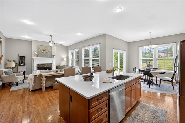 201 Venango Trl, Marshall, PA 16046 - kitchen featuring stainless steel appliances, a ceiling fan, a fireplace, light wood-type flooring, and recessed lighting