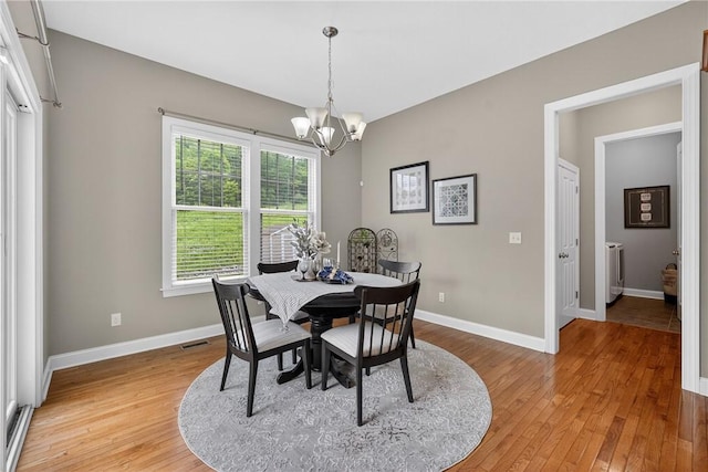201 Venango Trl, Marshall, PA 16046 - dining room featuring a chandelier and light wood-style floors