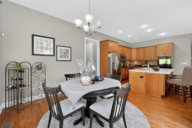 201 Venango Trl, Marshall, PA 16046 - dining room with a chandelier, light wood-style floors, and recessed lighting