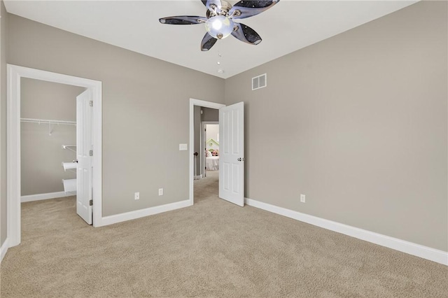 201 Venango Trl, Marshall, PA 16046 - unfurnished bedroom featuring light carpet, a walk in closet, ceiling fan, and a closet
