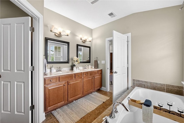 201 Venango Trl, Marshall, PA 16046 - bathroom with double vanity, a bath, tile patterned flooring, and lofted ceiling