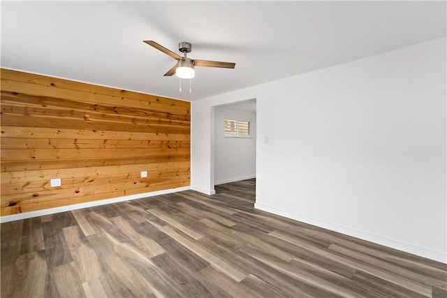 103 Church Ave, Mount Oliver, PA 15210 - empty room featuring ceiling fan, dark wood-type flooring, and wooden walls
