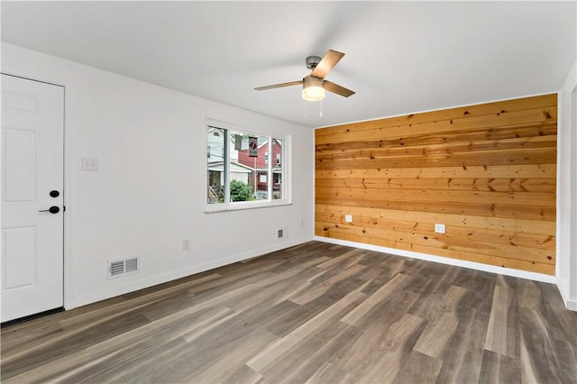 103 Church Ave, Mount Oliver, PA 15210 - unfurnished room with a ceiling fan, wood finished floors, and wooden walls