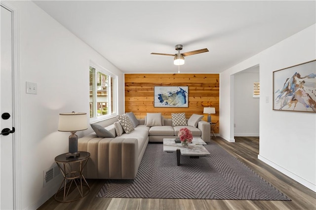 103 Church Ave, Mount Oliver, PA 15210 - living room featuring ceiling fan, wood finished floors, and wooden walls