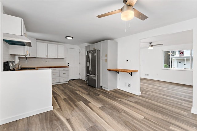 103 Church Ave, Mount Oliver, PA 15210 - kitchen featuring under cabinet range hood, stainless steel fridge, ceiling fan, and wooden counters