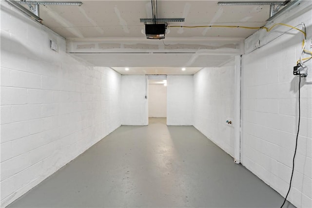 103 Church Ave, Mount Oliver, PA 15210 - garage with a garage door opener and concrete block wall