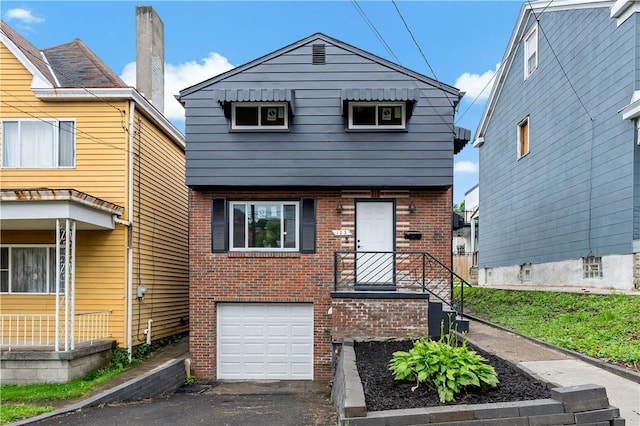 103 Church Ave, Mount Oliver, PA 15210 - view of front of home featuring brick siding, an attached garage, and asphalt driveway
