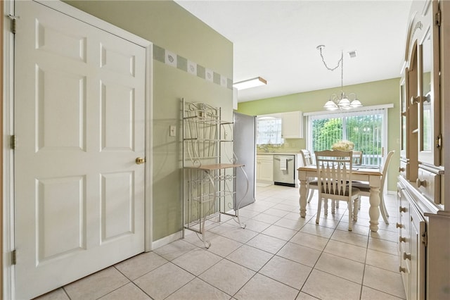 31 Elena Ave, Lower Burrell, PA 15068 - dining room with light tile patterned flooring and a chandelier