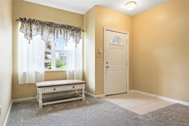 31 Elena Ave, Lower Burrell, PA 15068 - foyer entrance featuring carpet flooring and tile patterned floors