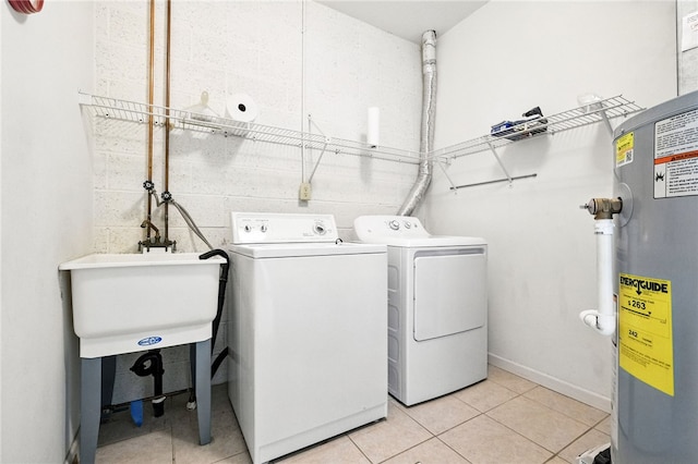 31 Elena Ave, Lower Burrell, PA 15068 - laundry area featuring electric water heater, independent washer and dryer, and light tile patterned floors