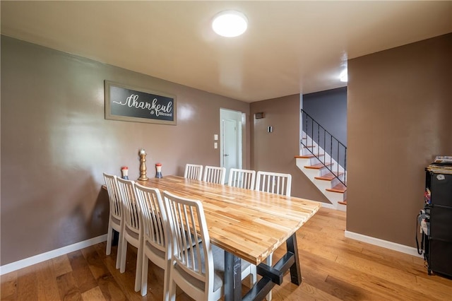 206 Bonnie St, Rostraver, PA 15012 - dining space with light wood-style flooring and stairway
