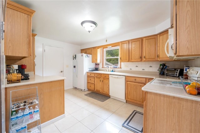 206 Bonnie St, Rostraver, PA 15012 - kitchen with white appliances, light countertops, decorative backsplash, and light tile patterned floors
