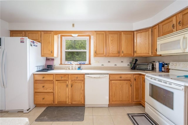 206 Bonnie St, Rostraver, PA 15012 - kitchen with white appliances, light countertops, decorative backsplash, and light tile patterned floors
