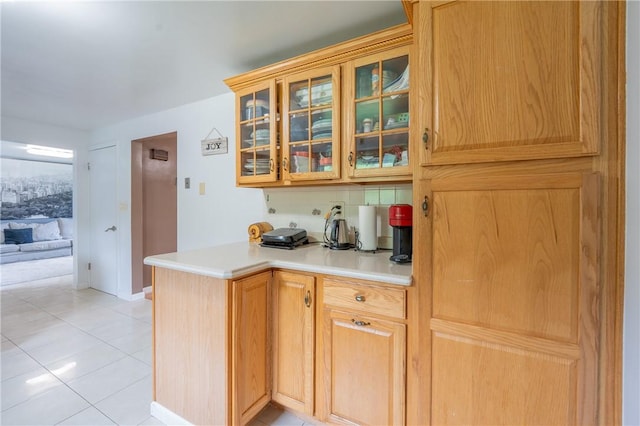 206 Bonnie St, Rostraver, PA 15012 - kitchen featuring light countertops, glass insert cabinets, and light tile patterned floors