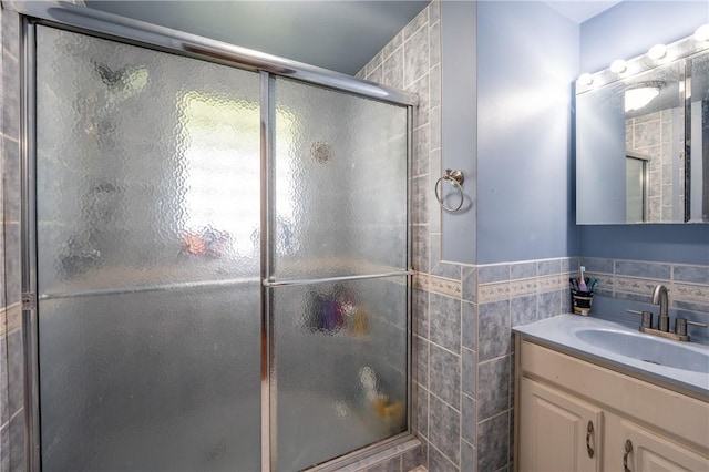 206 Bonnie St, Rostraver, PA 15012 - full bathroom with tile walls, a shower with door, and vanity