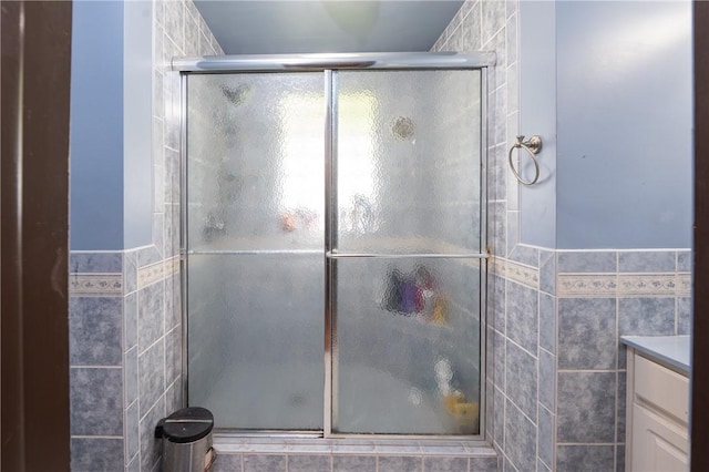 206 Bonnie St, Rostraver, PA 15012 - bathroom with a shower with shower door, tile walls, and vanity