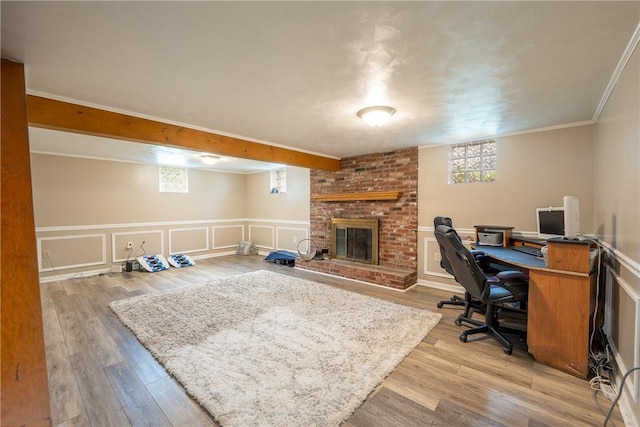 206 Bonnie St, Rostraver, PA 15012 - office featuring a brick fireplace, light wood-style floors, and a wainscoted wall