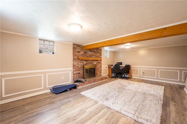 206 Bonnie St, Rostraver, PA 15012 - living area featuring plenty of natural light, wood finished floors, a brick fireplace, an office area, and a decorative wall