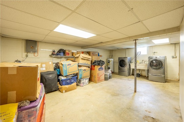 206 Bonnie St, Rostraver, PA 15012 - basement with water heater, separate washer and dryer, electric panel, a paneled ceiling, and concrete block wall