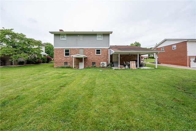 206 Bonnie St, Rostraver, PA 15012 - back of house featuring a lawn, brick siding, and a chimney