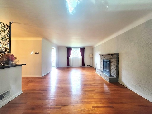 1176 Colgate Dr, Monroeville, PA 15146 - unfurnished living room featuring a fireplace and wood finished floors