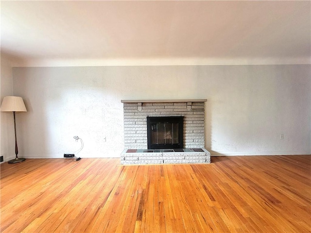 1176 Colgate Dr, Monroeville, PA 15146 - unfurnished living room featuring wood finished floors and a fireplace