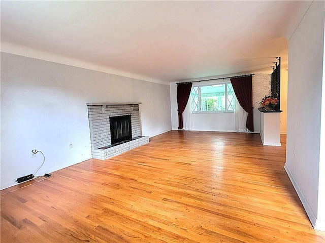 1176 Colgate Dr, Monroeville, PA 15146 - unfurnished living room with light wood finished floors and a fireplace
