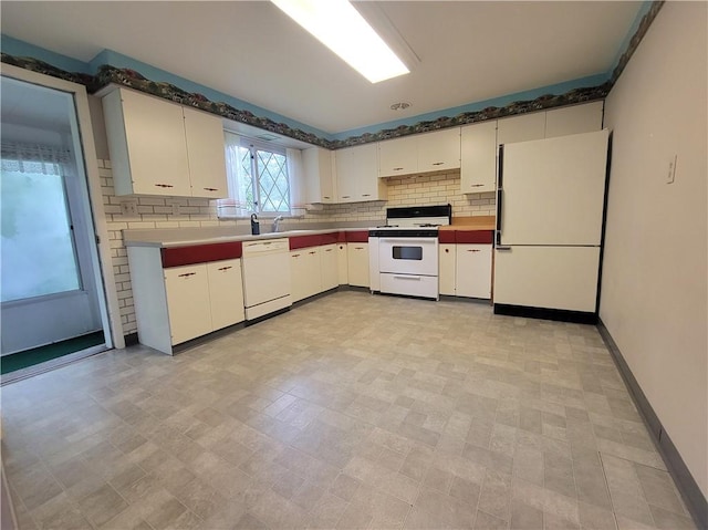 1176 Colgate Dr, Monroeville, PA 15146 - kitchen featuring white appliances, white cabinetry, and backsplash