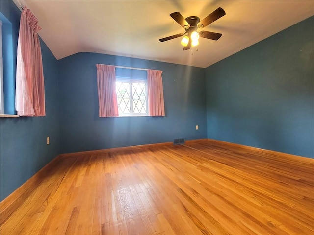 1176 Colgate Dr, Monroeville, PA 15146 - empty room with lofted ceiling, ceiling fan, and wood-type flooring
