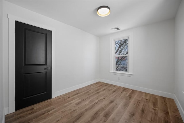 141 Blackhawk St, Squirrel Hill, PA 15218 - spare room with baseboards and wood finished floors
